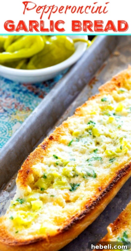 Close-up of a single slice of Pepperoncini Garlic Bread, showcasing the golden crust and visible pepperoncini pieces.