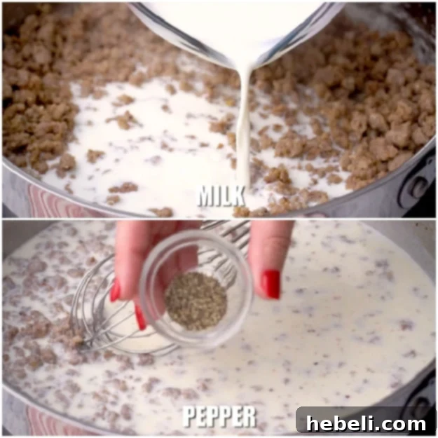 Gradually whisking milk into the sausage and flour mixture to create creamy gravy.