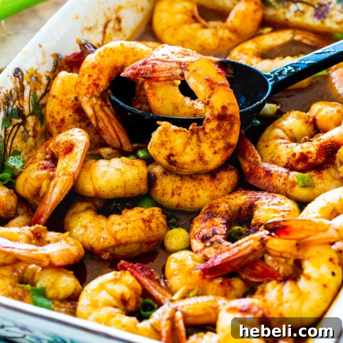 Cajun Honey Shrimp Bake 2 Delicious Baked Honey Cajun Shrimp in a baking dish, perfectly cooked and ready to serve.