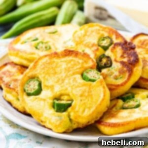 Okra Hoecakes piled up on a plate.
