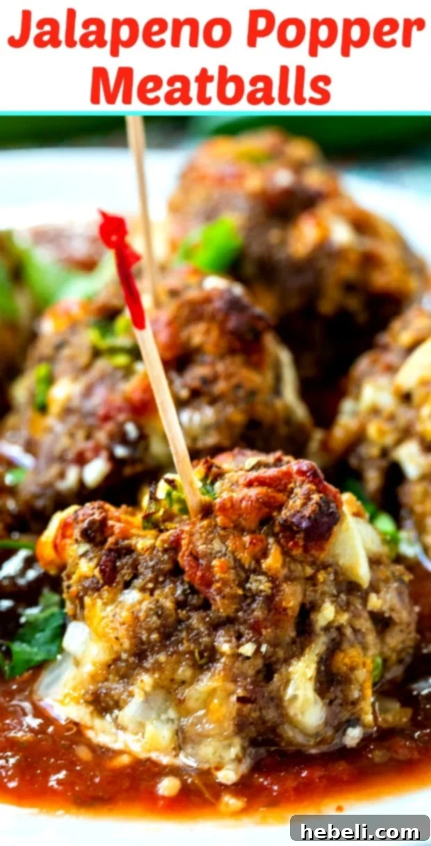 A large platter of Jalapeno Popper Meatballs, garnished with fresh cilantro and lime wedges, ready for serving.