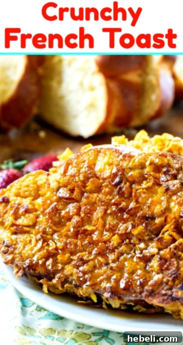 A beautifully plated stack of golden brown Crunchy French Toast, elegantly garnished with a light sprinkle of powdered sugar and a vibrant assortment of fresh berries, perfectly ready for a delicious breakfast.