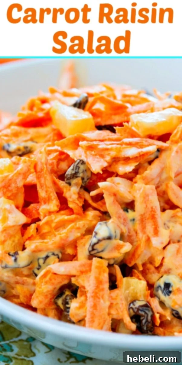Sunshine Carrot Raisin Salad 6 Close-up of a vibrant Carrot Raisin Salad, showcasing its inviting texture and colors.