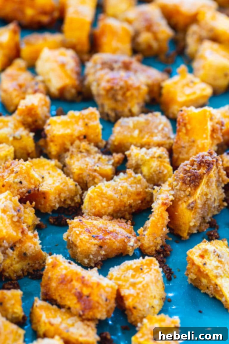 Platter of freshly baked Shake and Bake Sweet Potatoes, garnished and ready to serve.