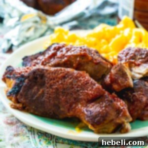 Instant Pot Country Style Ribs on plate with mac and cheese.