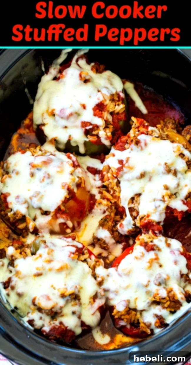Close-up of Slow Cooker Stuffed Peppers topped with melted mozzarella cheese.