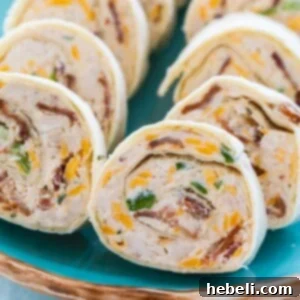 Chicken, Bacon and Cheddar Pinwheels - close-up of a stack.
