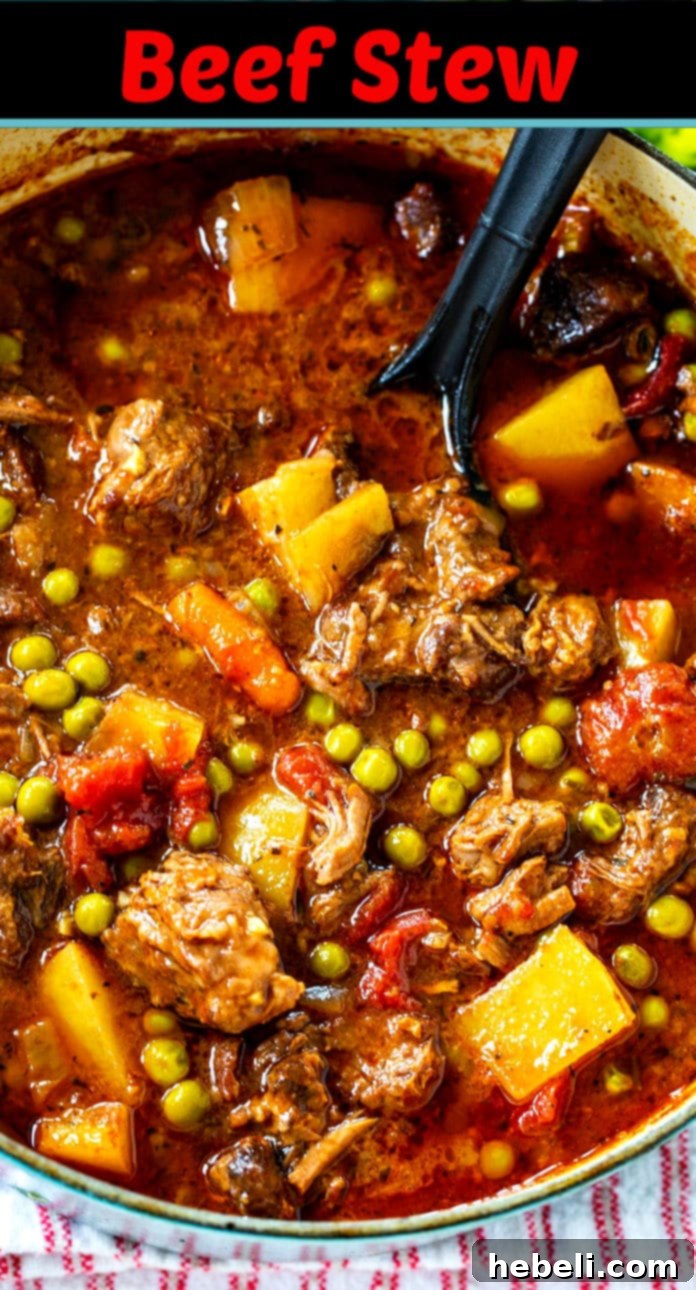 A large serving of Classic Beef Stew with potatoes, peas, and carrots in a bowl.