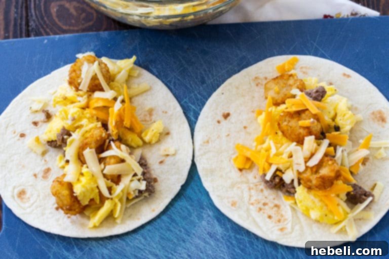 Close-up of the sausage, scrambled egg, and tater tot filling before being rolled into tortillas.