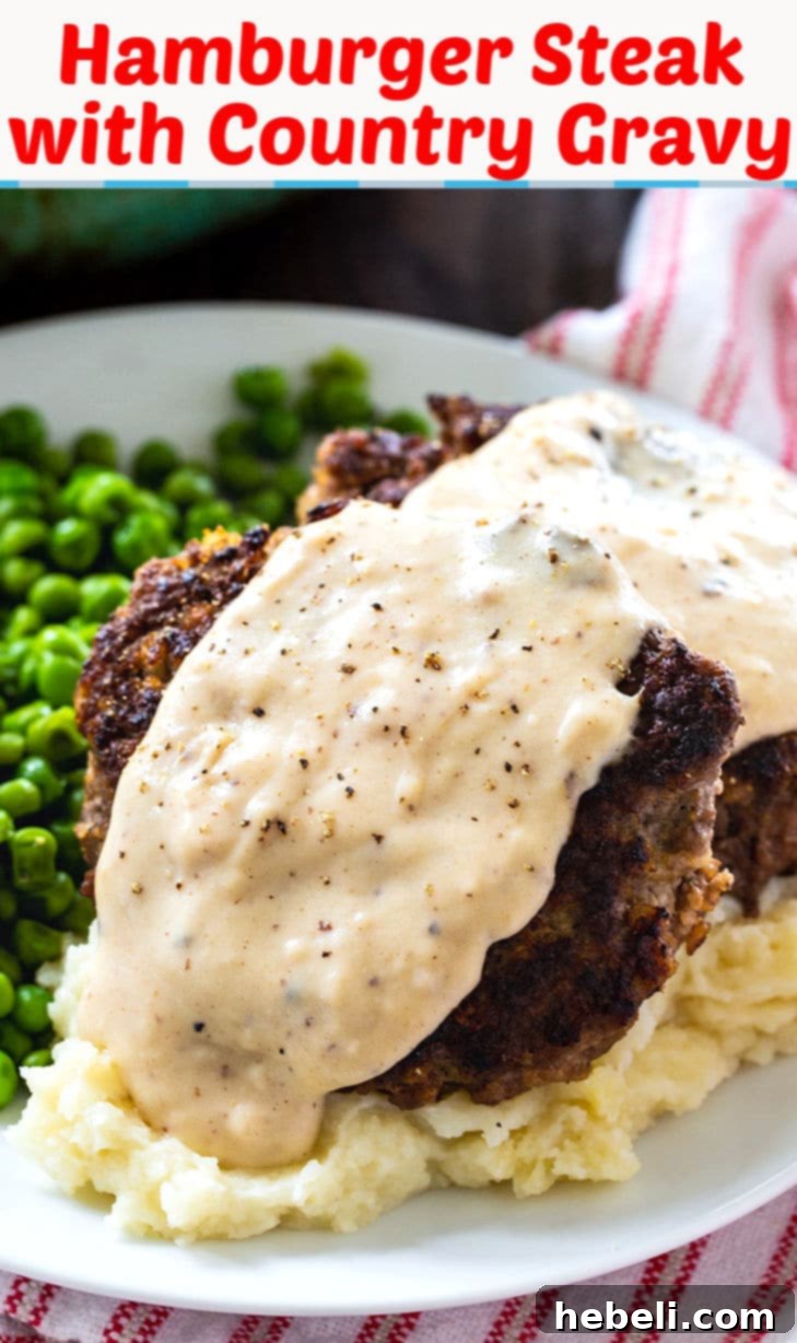 A freshly cooked Hamburger Steak with Country Gravy, plated and ready to eat. The image emphasizes the rich gravy and the tender patty, promising a delicious and quick meal.