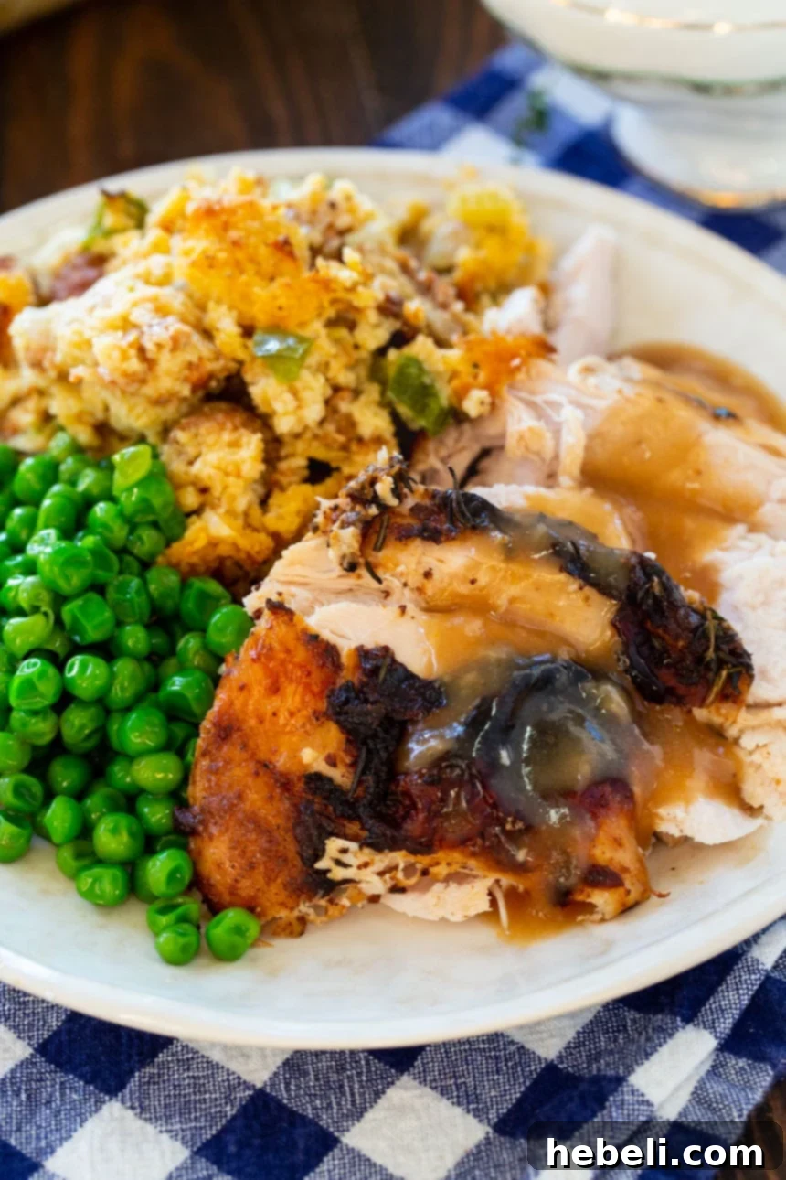 Sliced Mayonnaise Roasted Turkey Breast on a cutting board.