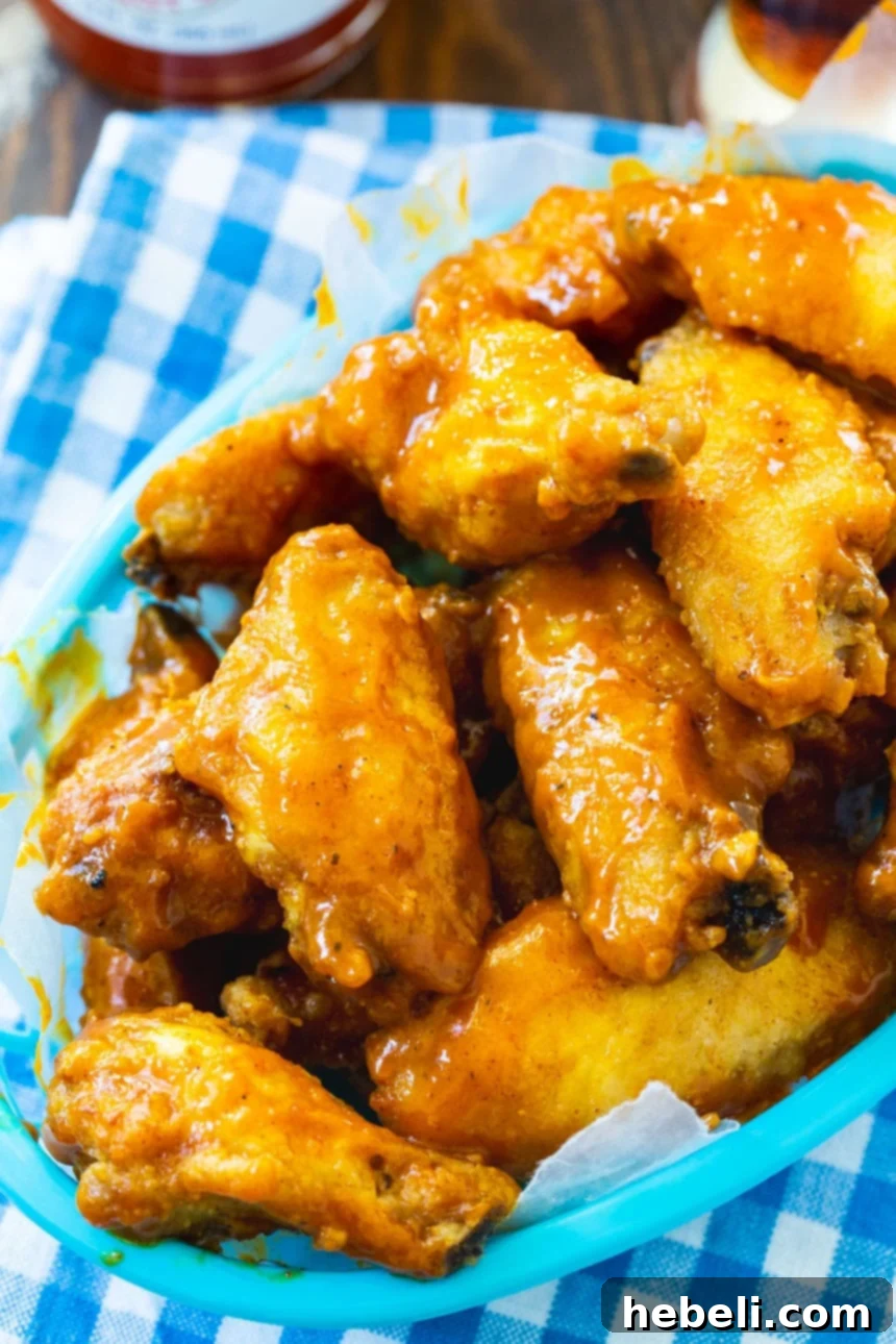 Zesty Carolina Mustard Wings 3 A close-up of Carolina Mustard Wings, showcasing their golden-brown crispiness and rich sauce coating.