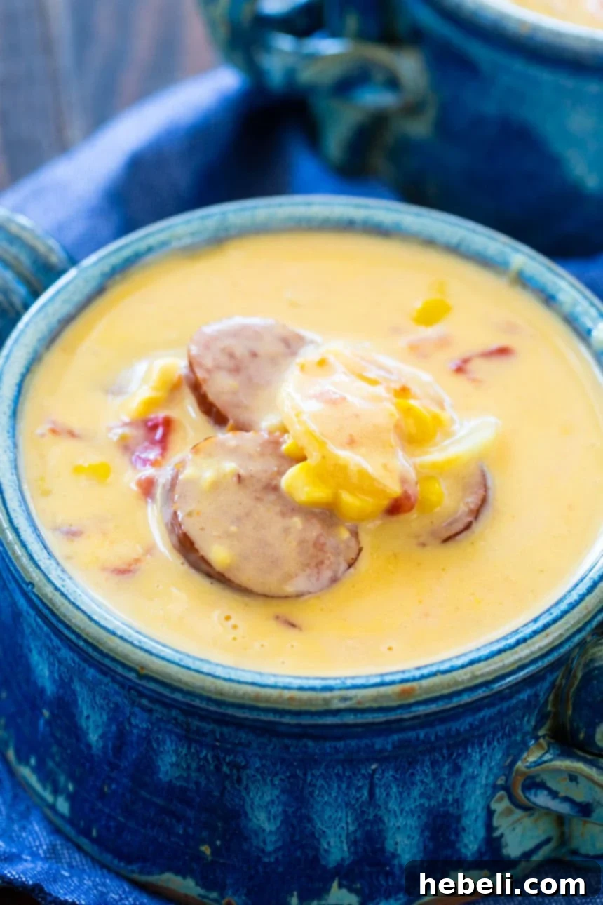 Smoky Sausage Nacho Potato Chowder 4 Easy Nacho Potato Soup with Smoked Sausage ready to be served, garnished with fresh cilantro.