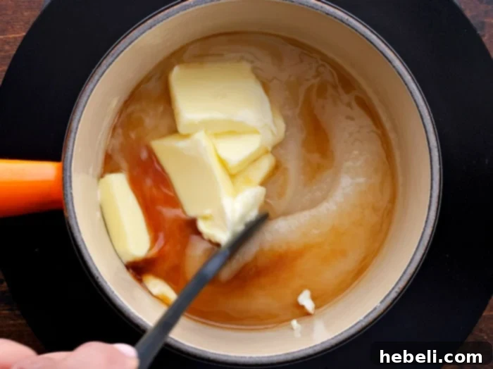 Glaze ingredients melting together in a saucepan on the stove.