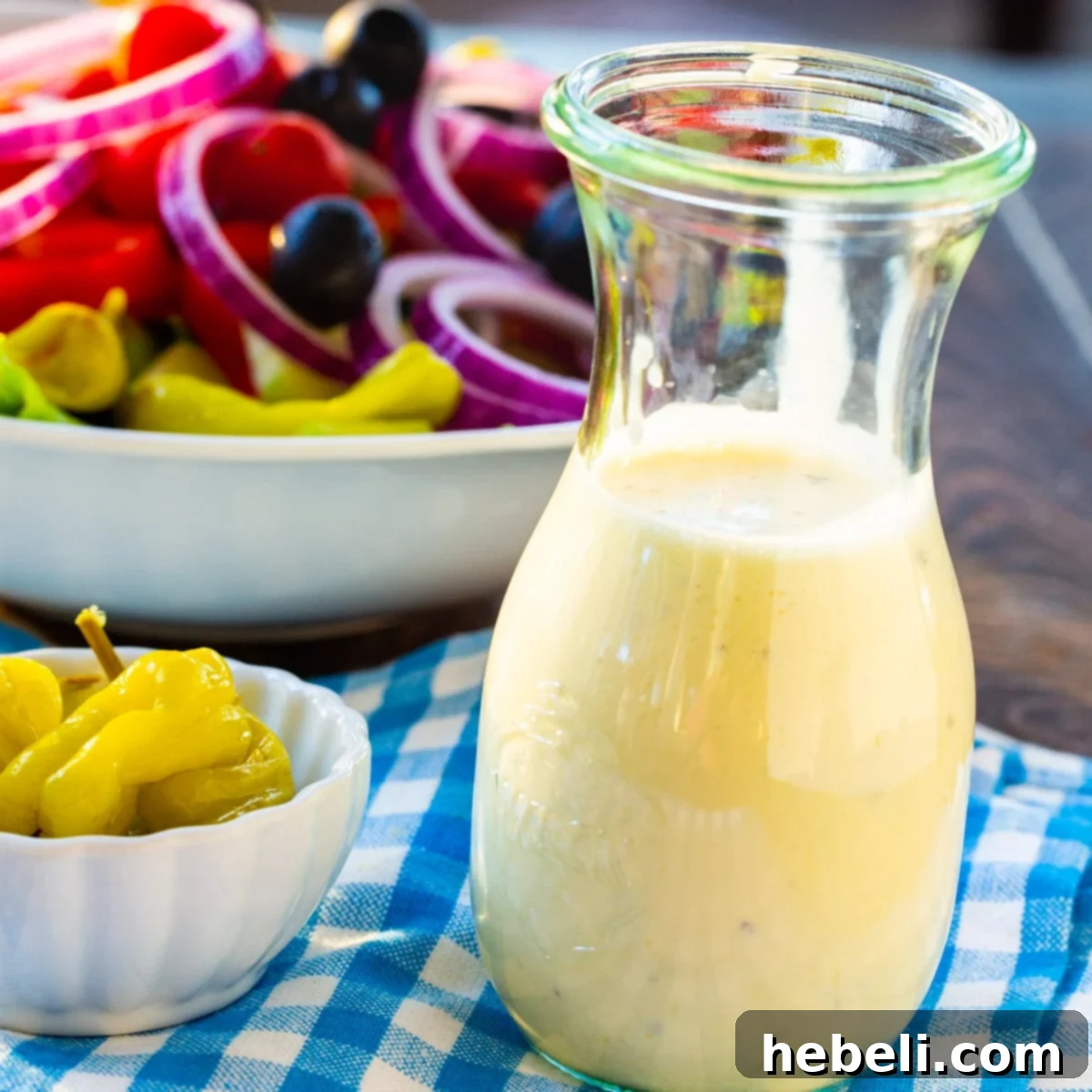Homemade Creamy Italian Dressing in a glass jar, ready to be served over a fresh salad.