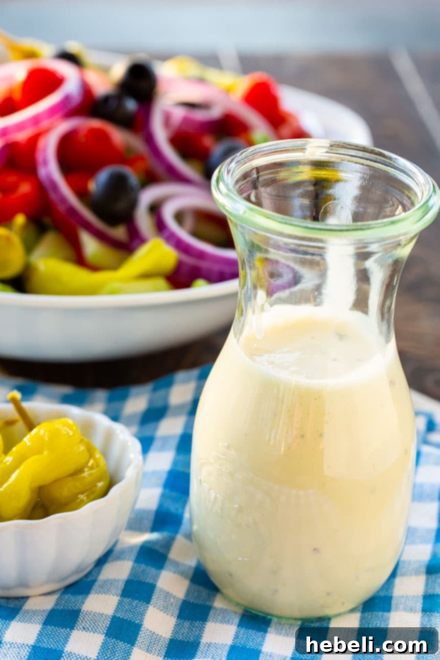 A fresh garden salad topped with homemade Creamy Italian Dressing, showcasing its versatility.