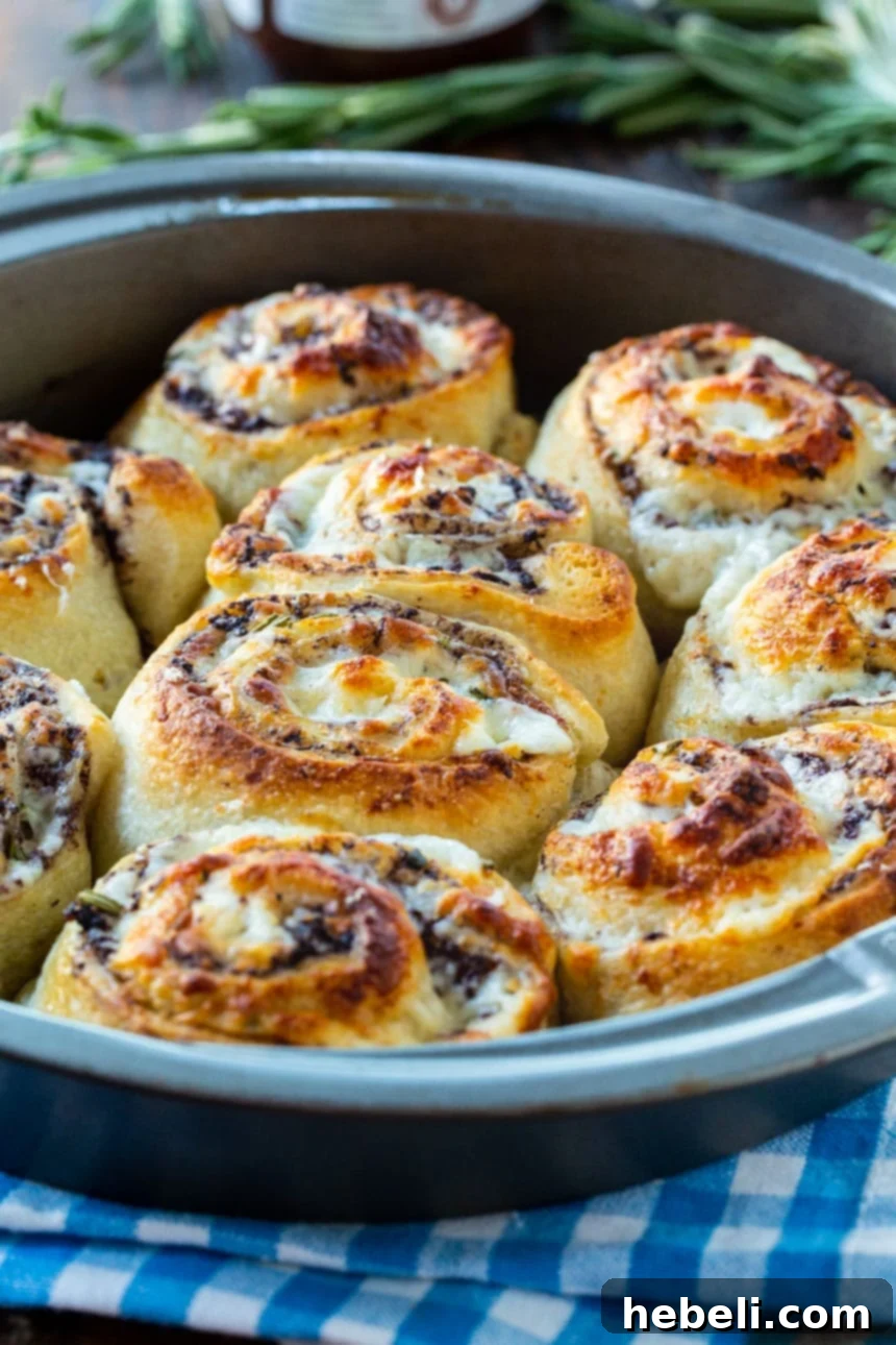 Golden Olive & Cheese Pinwheels 4 Olive Cheese Rolls baked in a 9-inch cake pan, with a golden-brown, crispy crust.