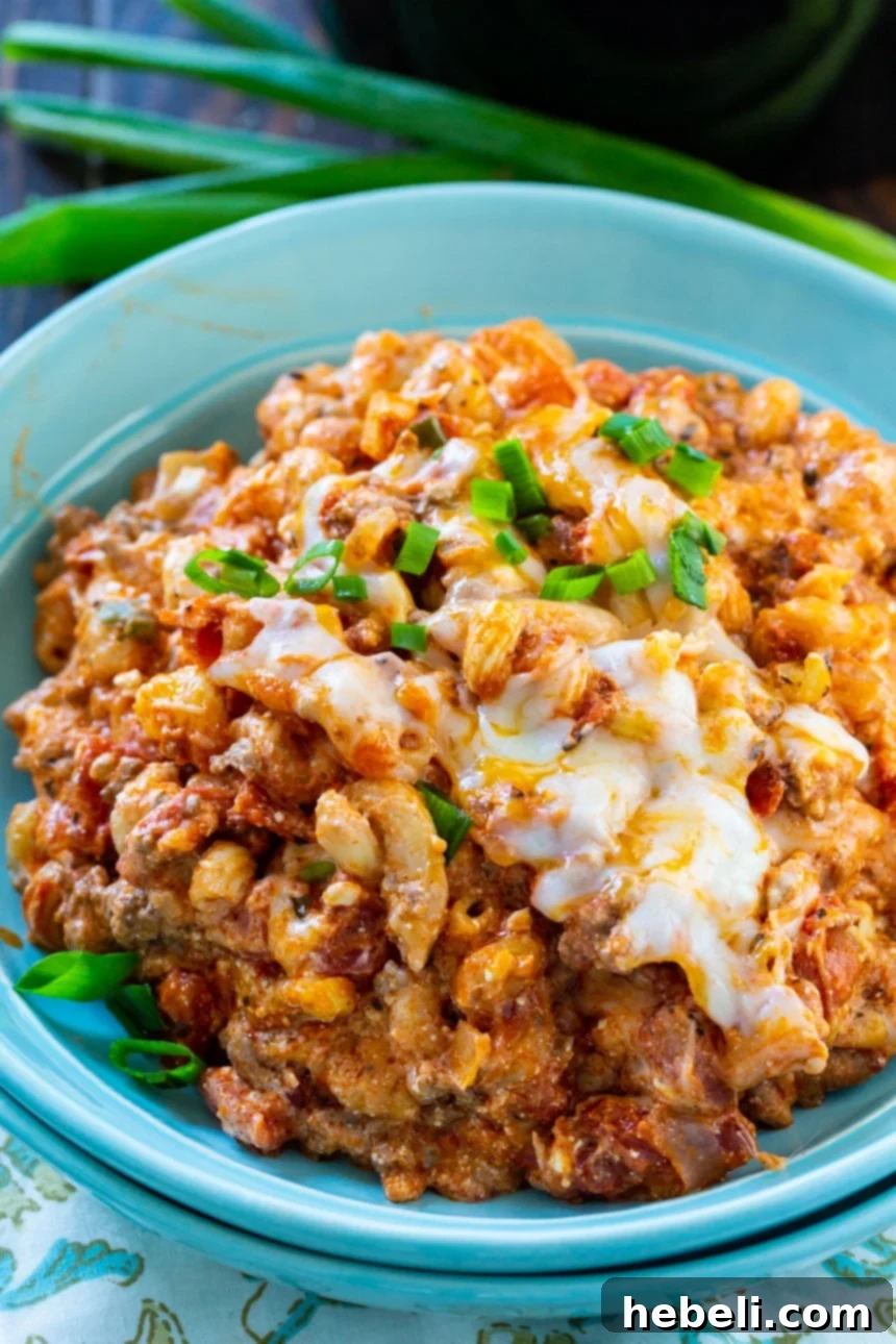 Slow Cooker Comforting Ground Beef Bake 5 A close-up of Crock Pot Homestyle Ground Beef Casserole, showcasing the pasta, beef, and melted cheese.