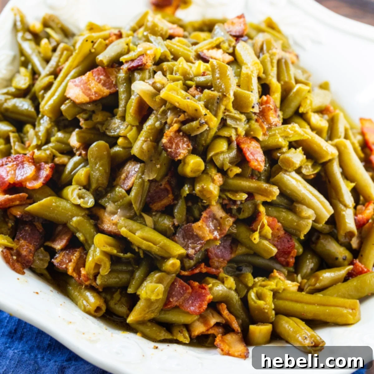 Crock Pot Garlic Buttery Bacon Green Beans 2 Crock Pot Buttery Bacon Green Beans on a serving dish, highlighting the rich, savory appeal.