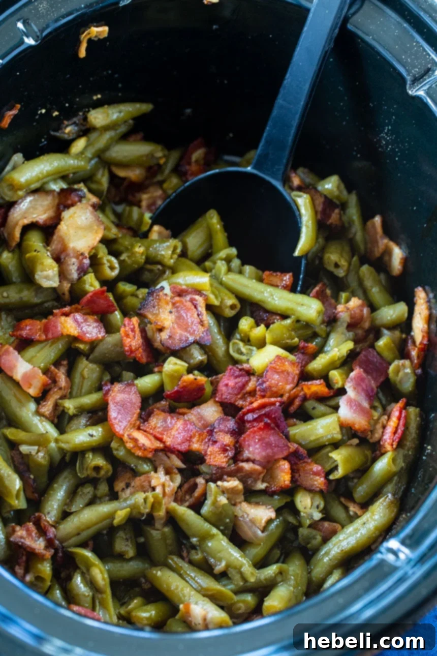 Crock Pot Garlic Buttery Bacon Green Beans 3 Bacon Green Beans cooked to perfection in the Slow Cooker, ready to serve.
