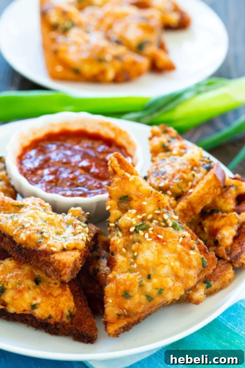 Batch of freshly fried homemade Shrimp Toast, golden brown and crispy, ready to be served as a delightful Chinese appetizer.