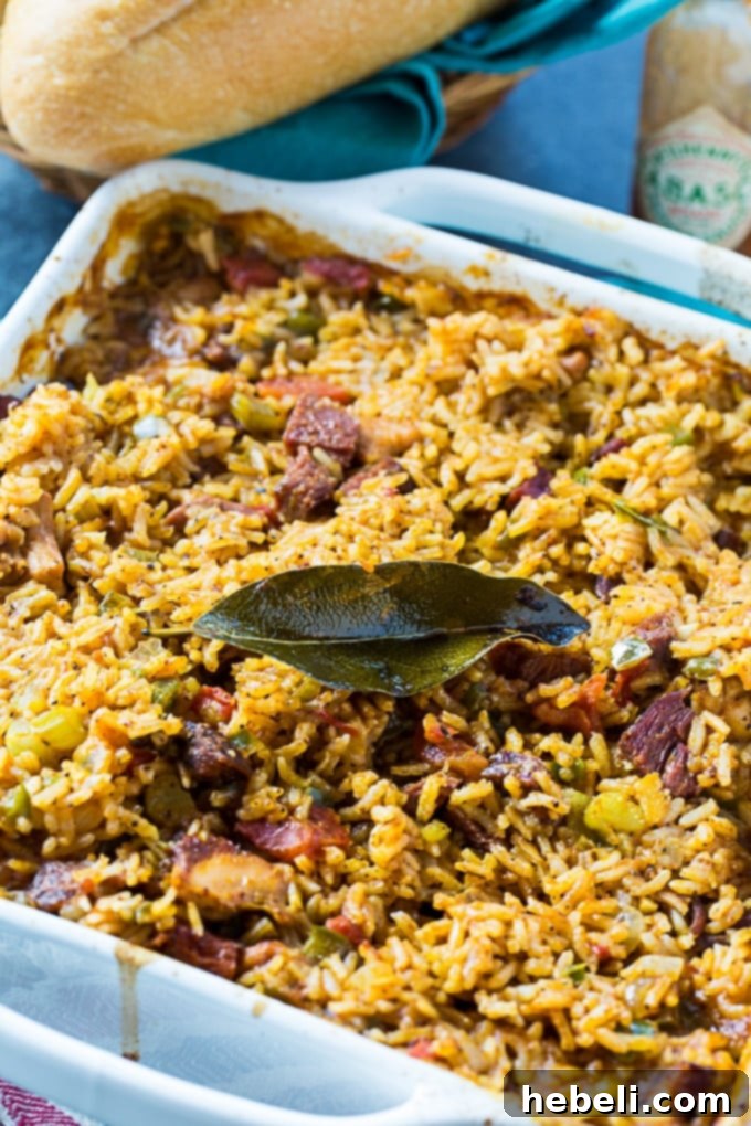 Paul Prudhomme's Chicken and Tasso Jambalaya, a spicy and flavorful Cajun rice dish with rich heritage