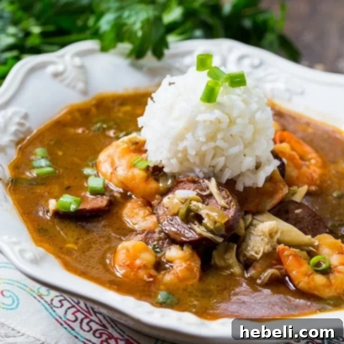 Seafood Gumbo topped with white rice, a rich and spicy New Orleans classic brimming with shrimp and crab