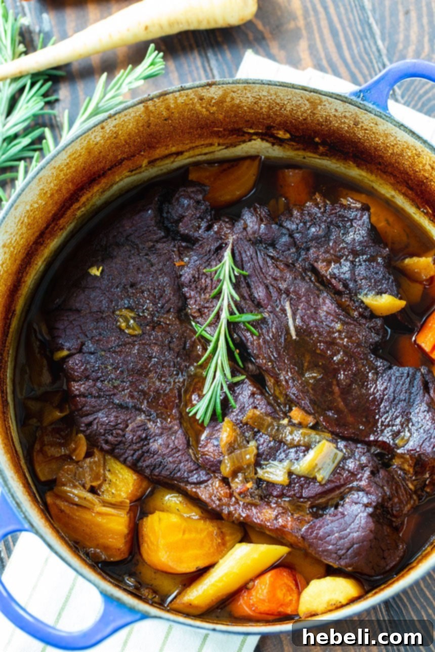Pot Roast slowly cooking in a classic Dutch oven, radiating warmth and flavor.