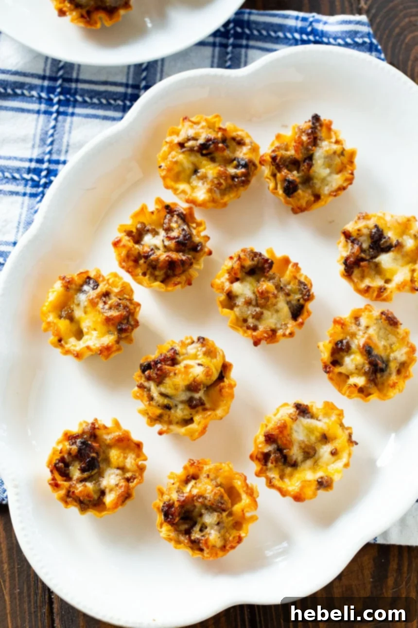 Close-up of the savory Sausage Ranch Phyllo Cup filling, featuring browned sausage, creamy ranch, and shredded cheese.