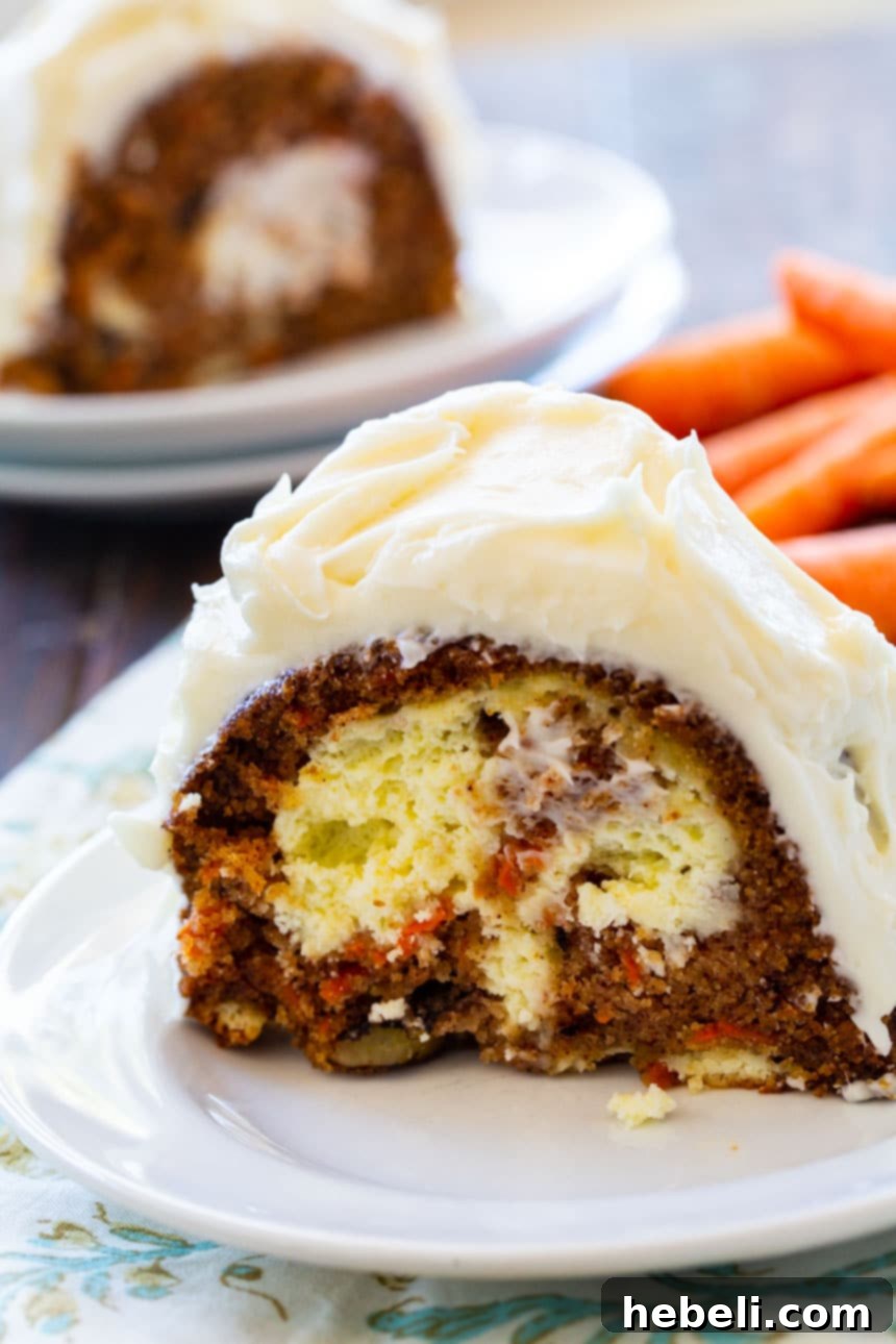 Close-up shot of a Carrot Cake filled with Cream Cheese, showing the cross-section.