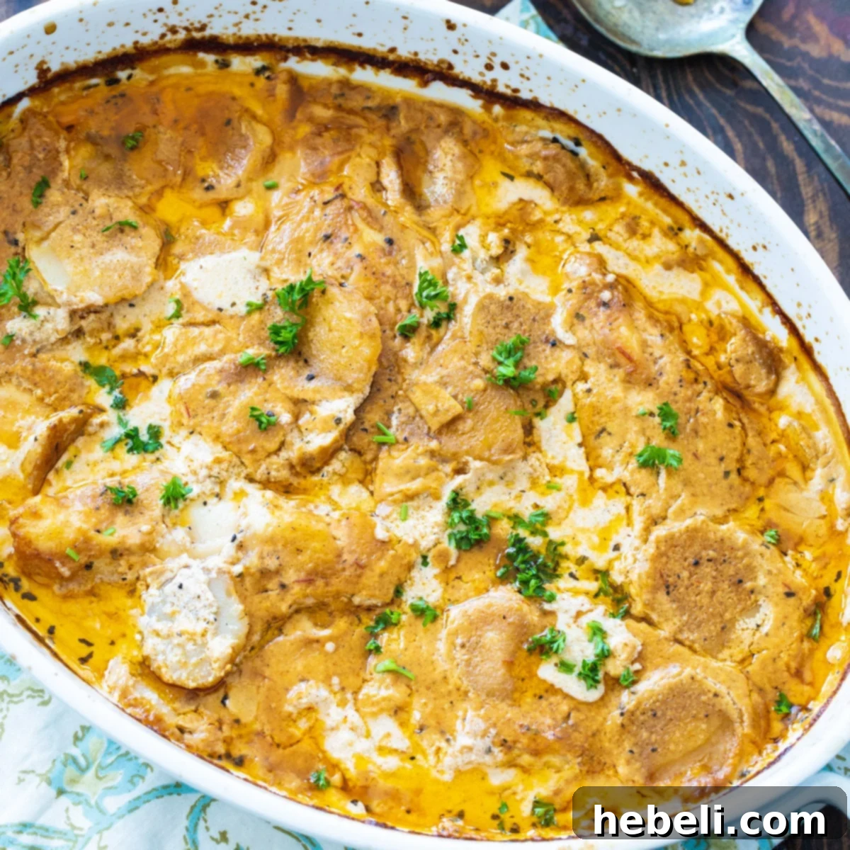 Chicken Paprikash in a casserole dish, richly coated in creamy sauce.