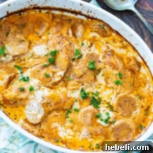 Baked casserole in an oval baking dish, golden and bubbly.