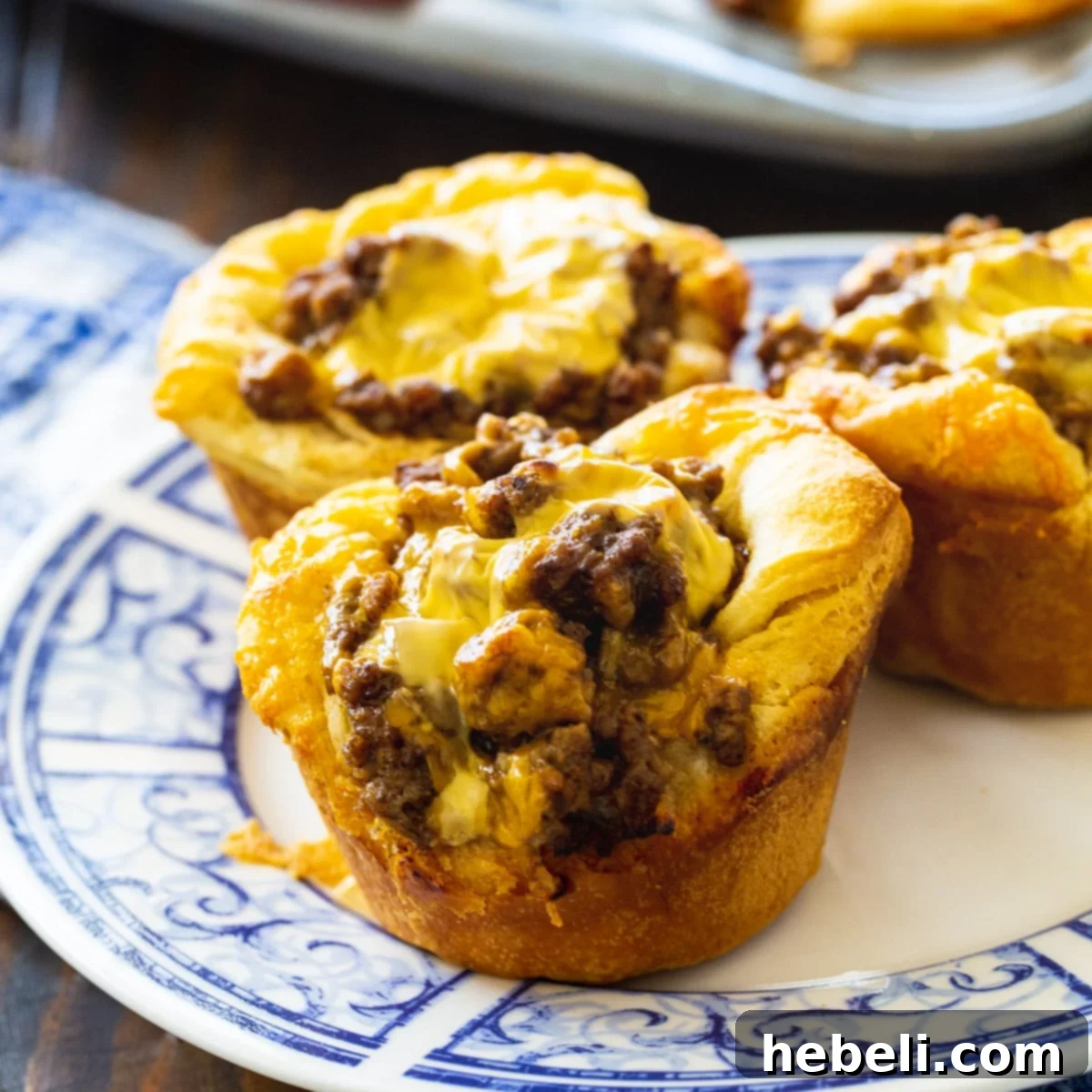 Three BBQ Ground Beef Biscuit Cups on a plate, ready to be served.