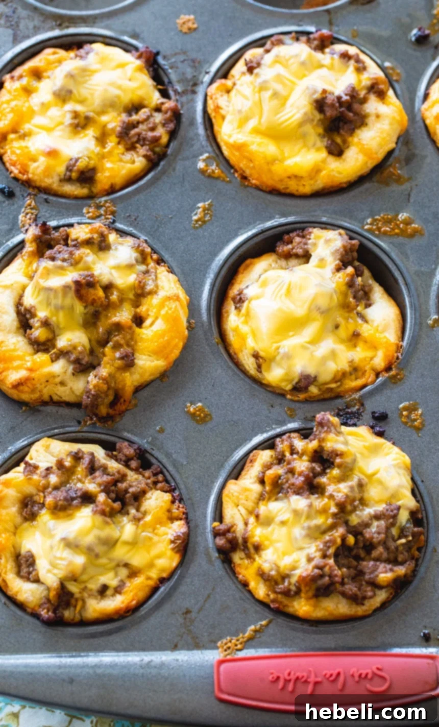 Close-up of a single BBQ Ground Beef Biscuit Cup showing the cheesy, meaty filling.