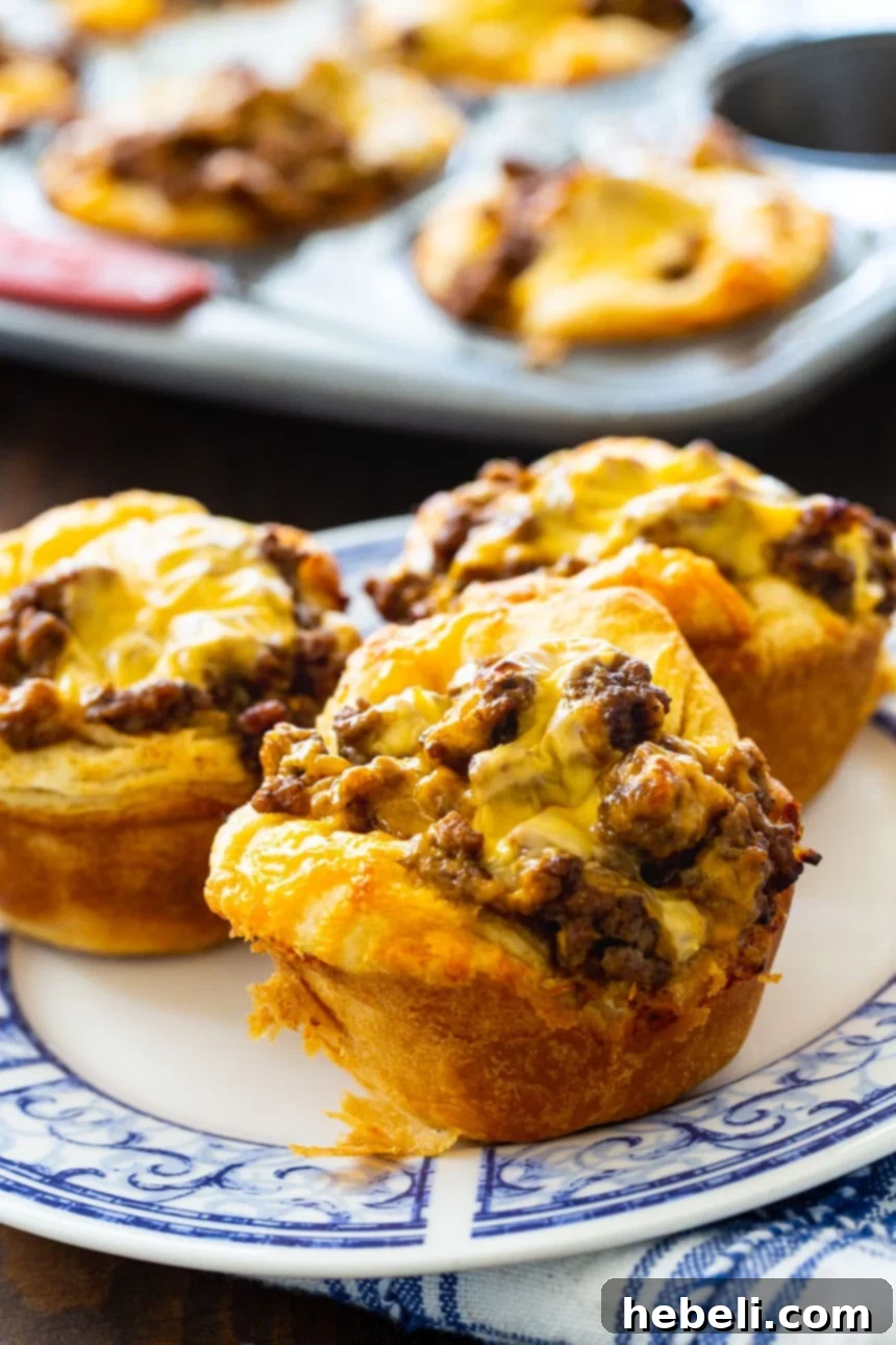 BBQ Ground Beef Biscuit Cups with cheese melting on top.