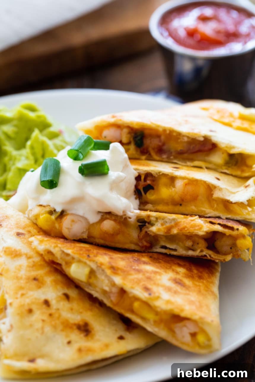 Sizzling Shrimp, Bacon and Corn Quesadillas 5 Beautifully cooked Shrimp, Bacon, and Corn Quesadilla on a plate, ready to be served.