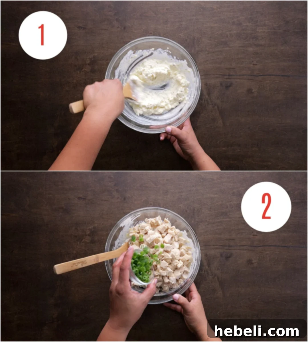 Chicken filling mixed in a mixing bowl.