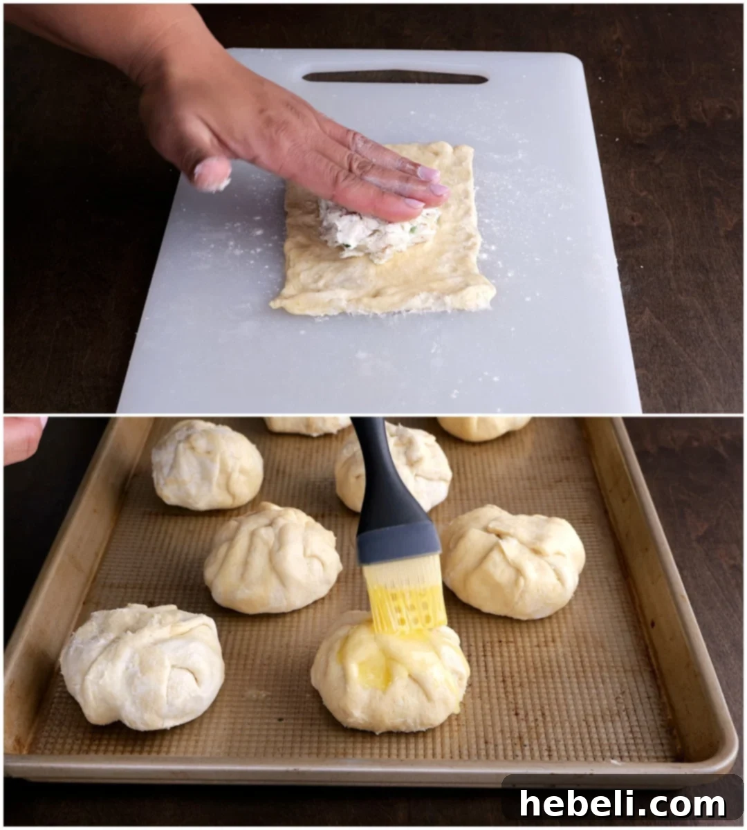 Chicken mixture placed on crescent dough and butter being brushed on bundles.