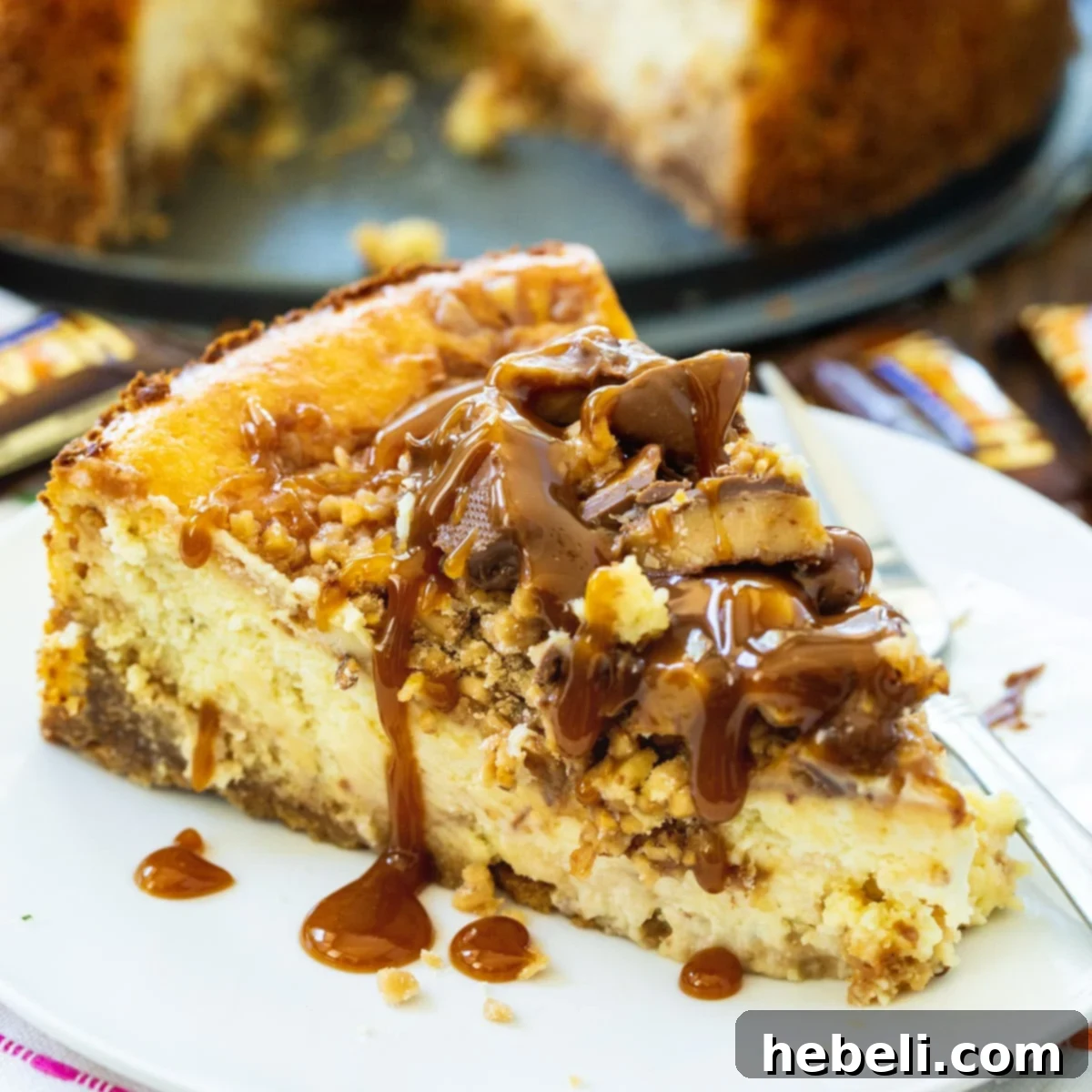 Luscious English Toffee Cheesecake 2 A perfectly sliced English Toffee Cheesecake on a white plate, showcasing its rich layers and topping.