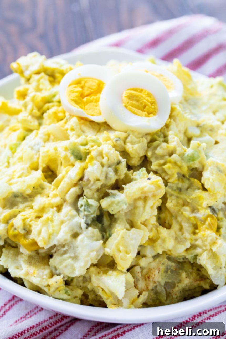 A close-up view of the creamy Southern Mustard Potato Salad, highlighting its inviting texture and classic ingredients.