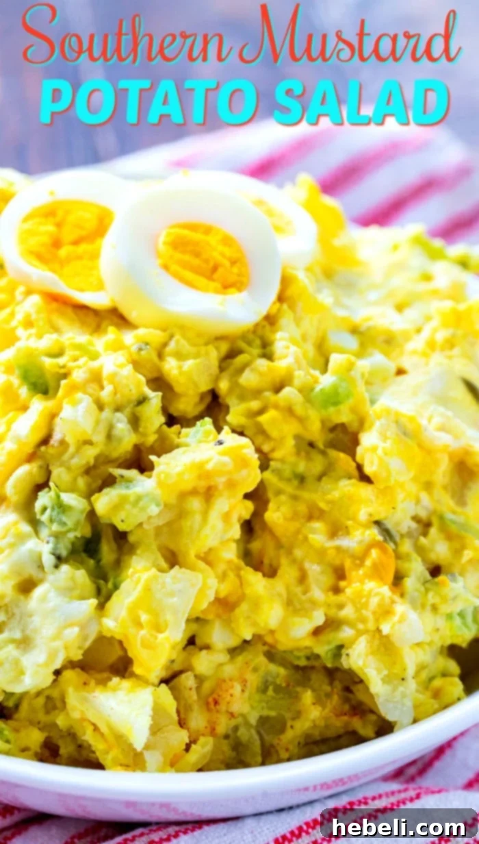 A beautifully presented close-up of Southern Mustard Potato Salad, garnished with fresh herbs and a sprinkle of paprika.