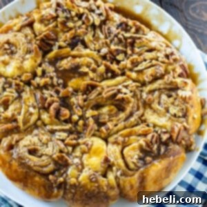 Cinnamon Rolls with Bourbon and Pecans on a white serving plate