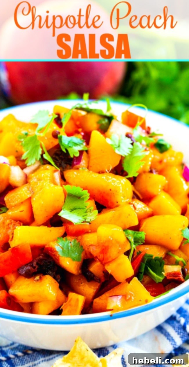 Smoldering Peach Salsa 6 Close-up view of a bowl filled with chunky Chipotle Peach Salsa, garnished with fresh cilantro, invitingly ready to serve.