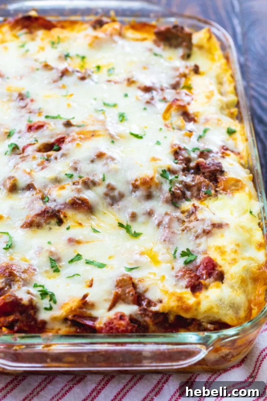 Velvety Cream Cheese Lasagna 3 A whole Cream Cheese Lasagna, freshly baked and golden brown, resting in a glass baking dish, ready to be served.