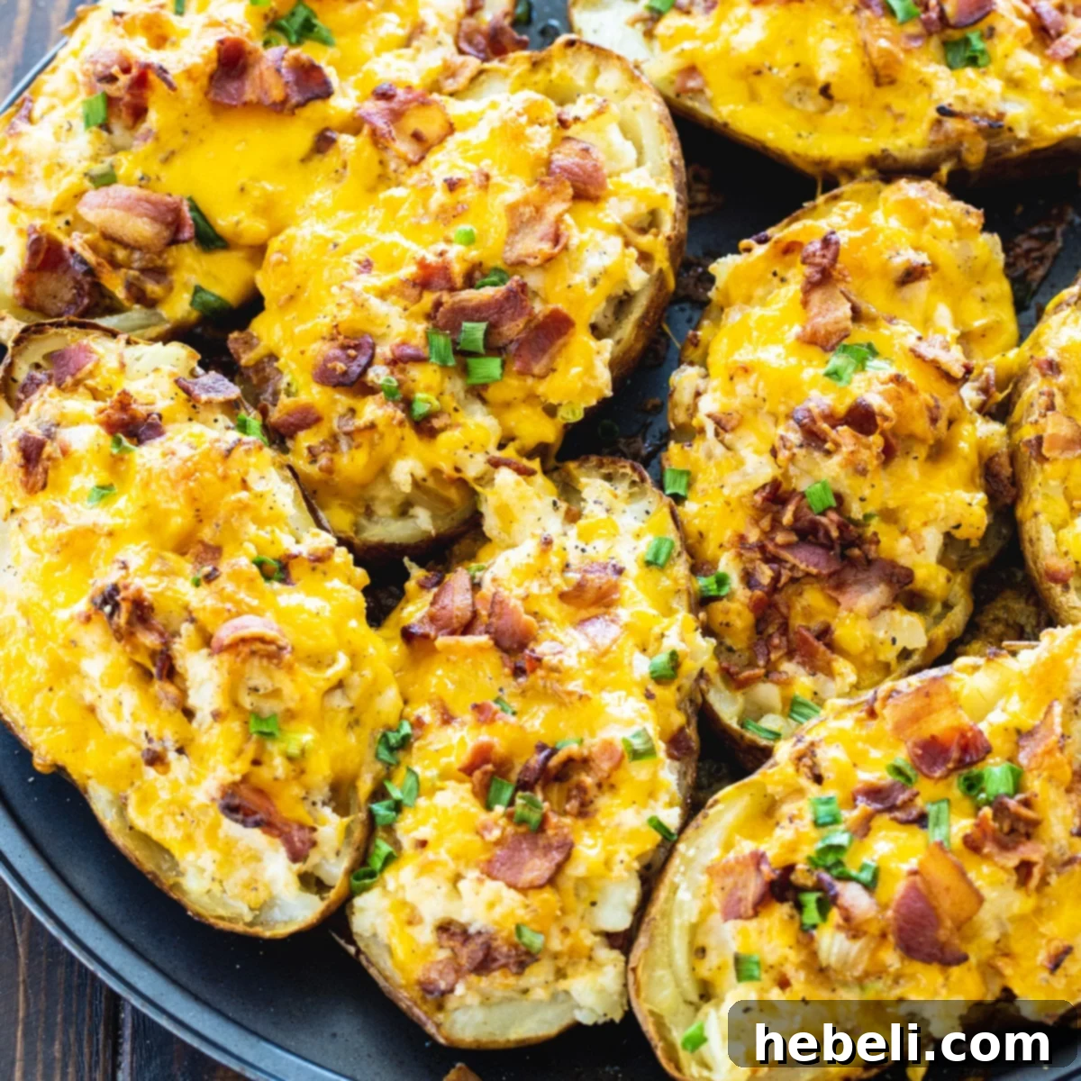 Golden-brown Twice Baked Potatoes on a baking sheet, ready to serve.
