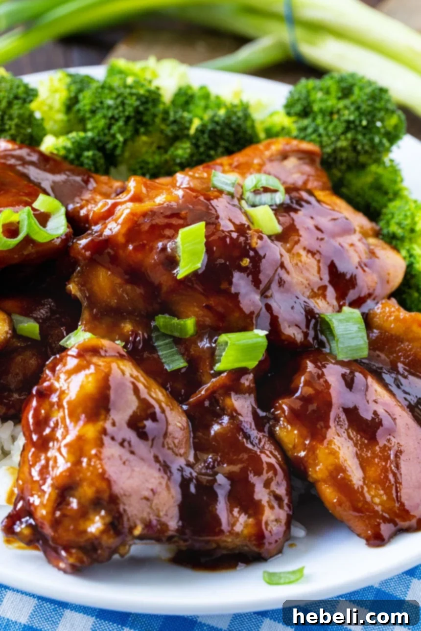 Close-up of glazed Bourbon Teriyaki Chicken with sesame seeds.