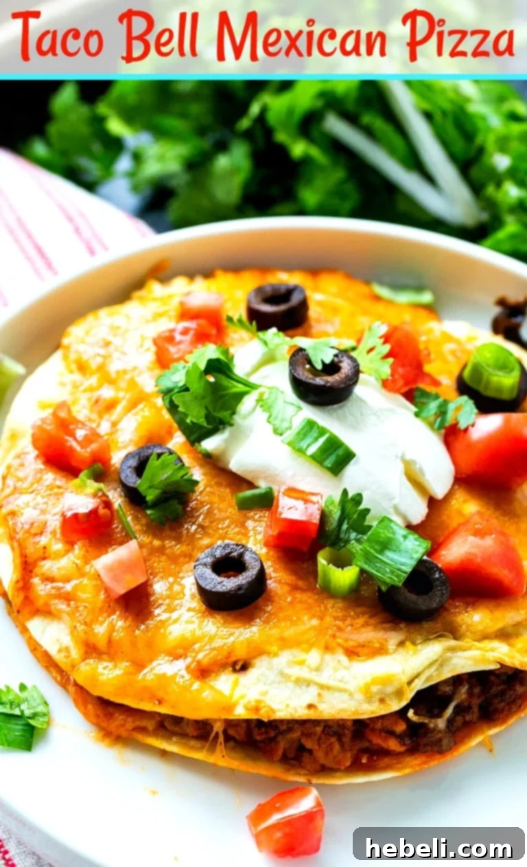 Two halves of a homemade Taco Bell Mexican Pizza on a white plate, showing the layers of beef, beans, and cheese.