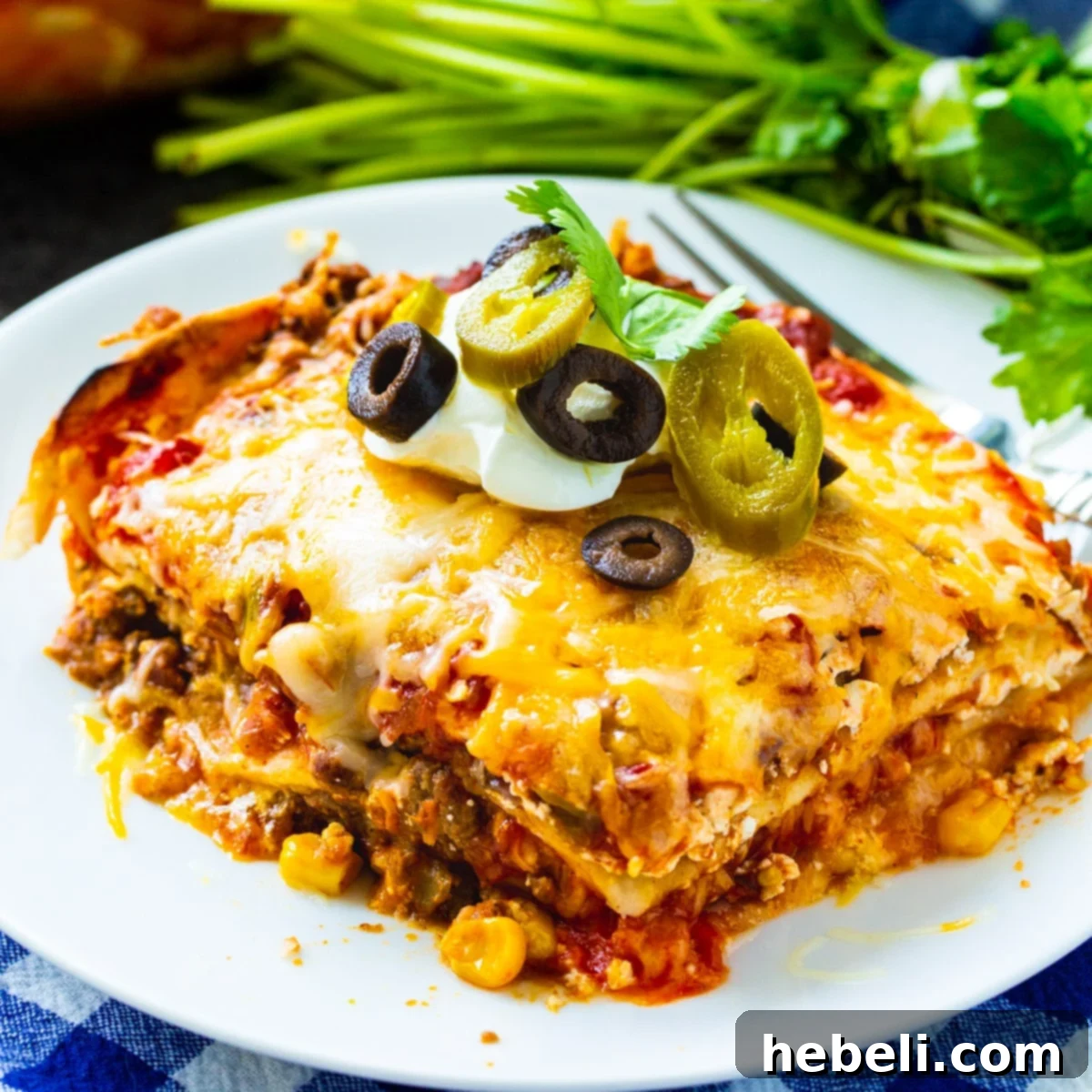 Slice of Mexican Lasagna on a plate, showcasing its delicious layers.