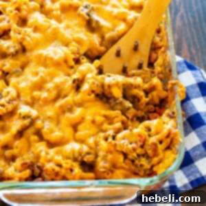 Chili Mac 5 A top-down view of a baking dish filled with cheesy Chili Mac, garnished and ready to eat.