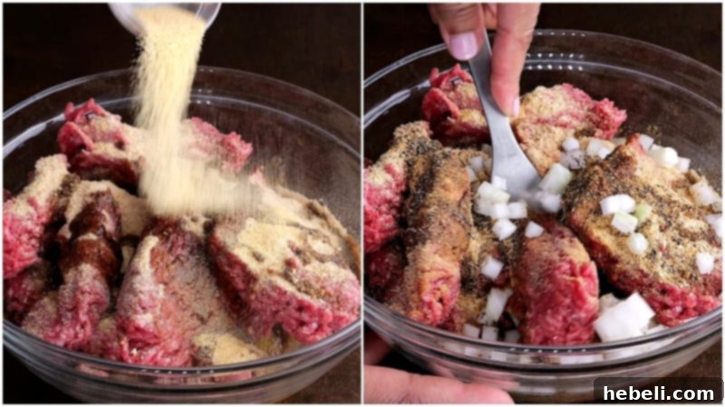 Hands gently mixing ground beef with various seasonings, egg, and breadcrumbs in a large mixing bowl, preparing the base for hamburger steak patties.